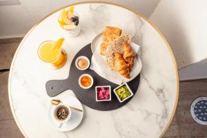 a table with a plate of breakfast foods on it at Casa D'Agostino in Santiago