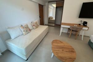 a living room with a couch and a table at Hypnos Boutique Hotel in Nicosia