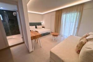 a hotel room with a bed and a table and a bedroom at Hypnos Boutique Hotel in Nicosia