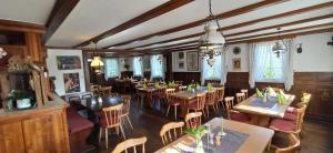 an overhead view of a restaurant with tables and chairs at Grüner Hof in Zell am Harmersbach +29 photos