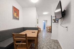 a dining room with a table and a couch at Representative City Villa in Meerbusch