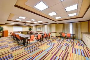 a conference room with a long table and chairs at Fairfield Inn & Suites Warner Robins in Warner Robins +22 photos