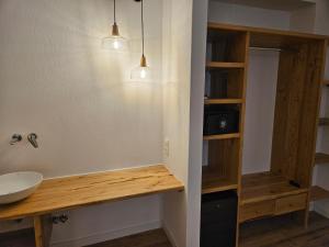 a bathroom with a wooden counter and a sink at Paralies Resort in Skiathos +56 photos