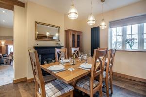 a dining room with a wooden table and chairs at 3 Bed in Brampton oc-g34639 in Brampton