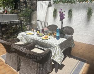 a table with chairs and a table with food on it at Residenz zu Caub - Rheinblick in Kaub +11 photos