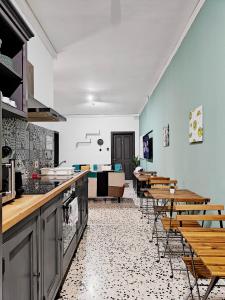 a kitchen with tables and chairs in a room at Cosyroom 3 in Pieta +21 photos