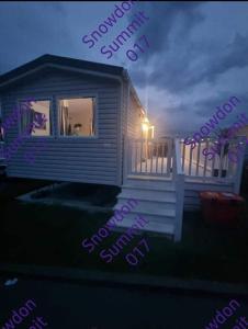 a rendering of a house with the words survival survival quit at Snowdon Summit 017 in Barmouth