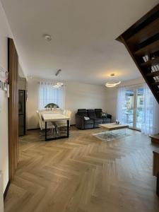 a living room with a couch and a table at Opole Calm House in Opole