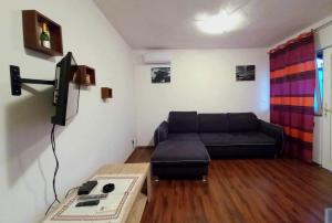a living room with a couch and a table at Apartments G&M in Vodice