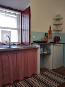 a kitchen with a sink and a counter top at Silves Historical House in Silves