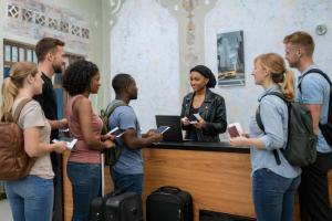 a group of people standing around a counter at Kivu Go-Lax Resort in Gisenyi