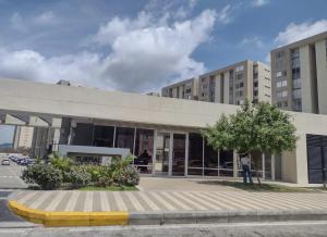 a person standing in front of a building at Alameda del rio Turpial in Barranquilla