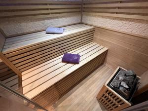 an overhead view of a sauna with a purple book at Appart Spa Privatif in Reims