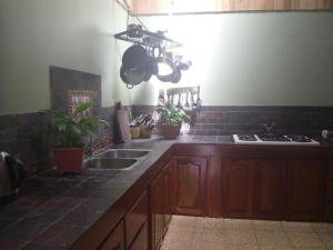 A kitchen or kitchenette at Rio Celeste Backpackers