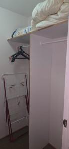 a dorm room with a bunk bed and a closet at Playa Las Torpederas in Valparaíso +2 photos