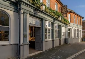 a row of shops on a street at Brewhouse & Kitchen - Bournemouth - Southbourne in Bournemouth