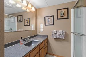 a bathroom with a sink and a mirror at Prairie Creek Cabin Getaway in Rapid City +27 photos