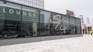 a large glass building with the words louvre store at Park Inn by Radisson Berlin Alexanderplatz in Berlin