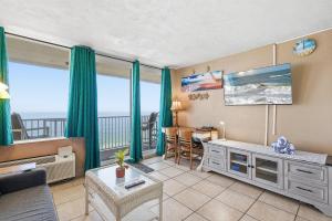 a living room with a view of the ocean at Daytona Harbour Beach Resort Unit 808 in Daytona Beach