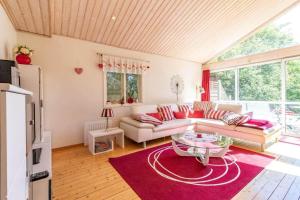 a living room with a couch and a table at HAL819-Unnaryd-Soedra-vaegen-29-b in Unnaryd
