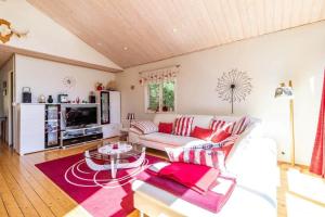 a living room with a couch and a table at HAL819-Unnaryd-Soedra-vaegen-29-b in Unnaryd