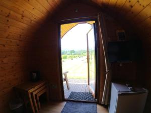an open door to a room with a view of a yard at Blossom in Welland
