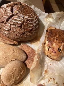 a group of bread sitting on a piece of paper at Gästehaus Margarita in Raubling +13 photos