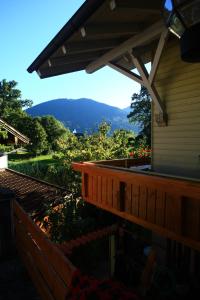 a deck with a view of a mountain at Gästehaus Margarita in Raubling