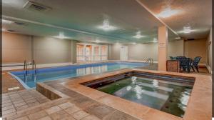 a pool in a building with a swimming pool at LongBranch #108 in Breckenridge