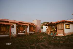 a group of houses with lights in front of them at Chalés VerdeSer in Sêrro