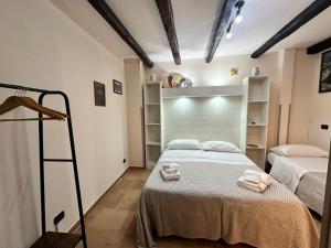 a bedroom with two beds and a ladder in it at B&B La Bastia in Scilla +21 photos