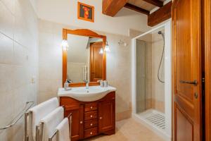 a bathroom with a sink and a shower at Casa Vecciano in Cetona +42 photos