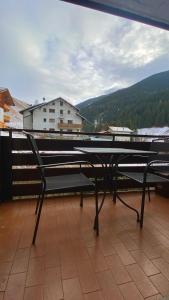a bench sitting on top of a balcony at Ca' Delle Nevi in SantʼAntonio +18 photos