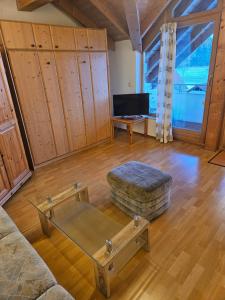 a living room with a couch and a coffee table at Gästehaus Cavallo in Achberg