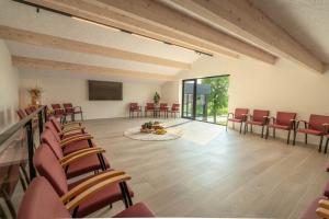 a conference room with chairs and a table and a screen at Oase 41 - 5 STAR location with Indoor swimming pool & unique landscape view in Sint-Laureins +62 photos