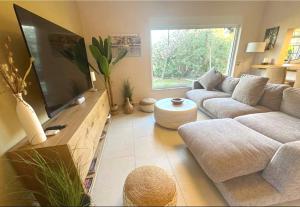 a living room with a large flat screen tv at Villa - Casa Ines in Cambrils