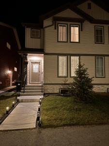 a house with a front door at night at Z FamilyHome Suites & Apartments in Calgary