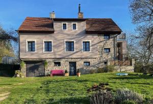 a large house on a hill with a yard at Honey Gardens venkovský apartmán v přírodní zahradě in Oleška +12 photos