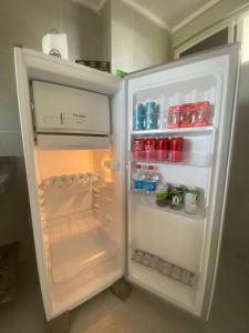 a refrigerator with its door open in a kitchen at Residencial T&D V AP 501 - À 5min do Centro e Faculdades in Mossoró