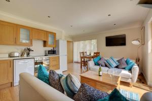 a living room with a couch and a table at 2 Bed in Ingworth oc-1731 in Ingworth
