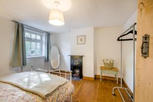 a bedroom with a bed and a mirror at 2 Bed in Beccles oc-d33611 in Beccles
