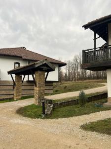 a house with a porch and a deck at Къща за гости Геша Форест 3 in Dryanovo