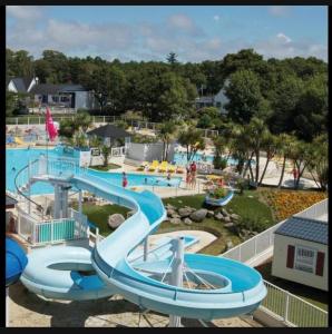 a large water park with a water slide at Mobil home 148 in Pont-Aven