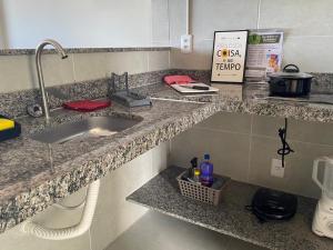 a kitchen with a sink and a counter top at Residencial T&D V AP 501 - À 5min do Centro e Faculdades in Mossoró