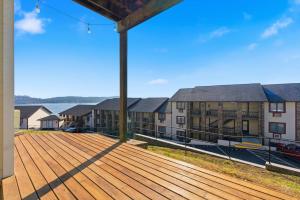 a view from the deck of a apartment building at Driftwood Den Condo for 2 in Kimberling City