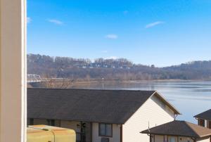 a view of a lake from a house at Driftwood Den Condo for 2 in Kimberling City +18 photos
