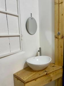 a bathroom with a white sink and a mirror at Casa Santa Rosa Garden in Santa Rosa de Cabal