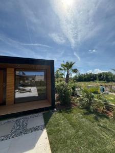 a large screen television on the side of a house at Villa Oasis Poreč in Labinci