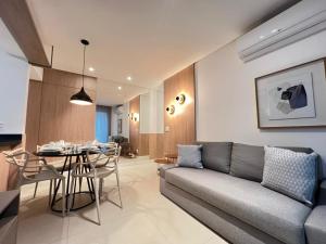 a living room with a couch and a table at LK Savassi 7 in Belo Horizonte