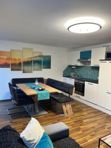 a living room with a table and a couch at Ferienwohnung Thöny in Vandans